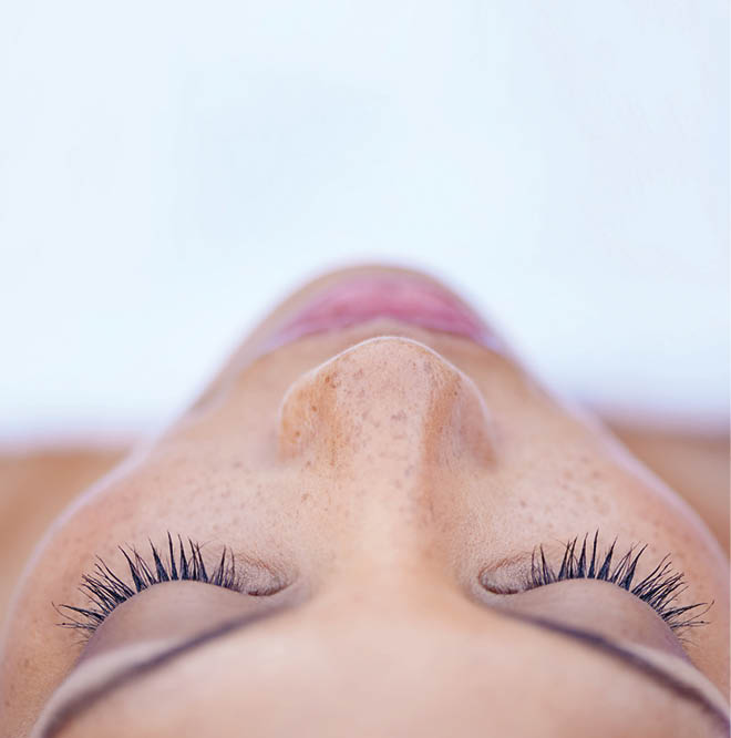 Cropped shot of an attractive young woman lying on her back