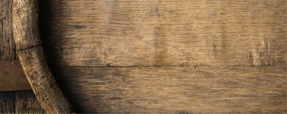 Old Wooden Beer Barrel on the Dark Background