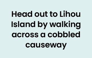Head out to Lihou Island by walking across a cobbled causeway 