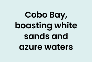 Cobo Bay, boasting white sands and azure waters 