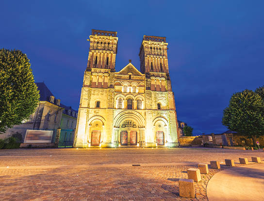 Abbaye Aux Dames, night view of Caen landmark.
