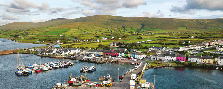 Portmagee fishing village on the Ring of Kerry Iveragh Peninsula. County Kerry, Ireland. Aerial drone view looking south