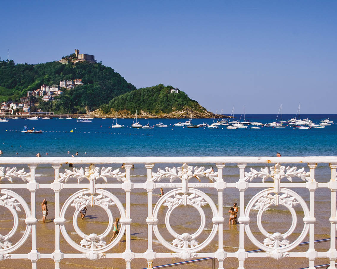 Handrail of the beach of La Concha with the island of Santa Clara in the background. San Sebastian, Spain.