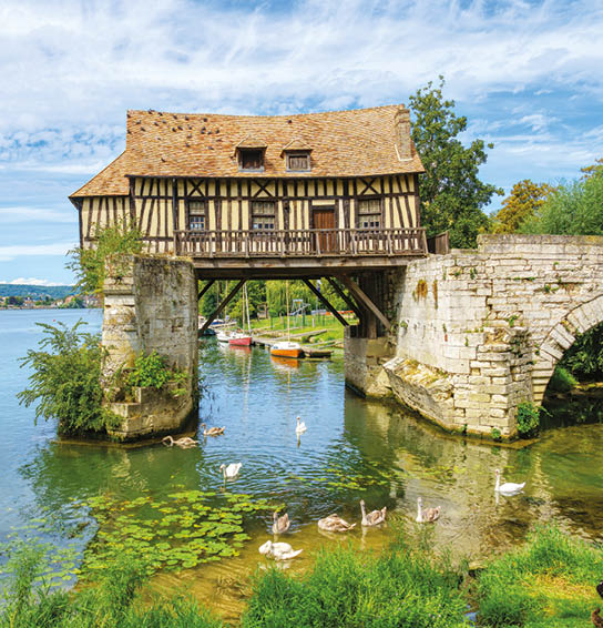 The Old mill (le veux moulin) on the Vernon broken bridge on Seine river with swans in the foreground- Vernon, Normandy, France